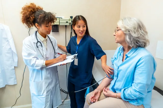 A nurse practitioner checking a patient's blood pressure